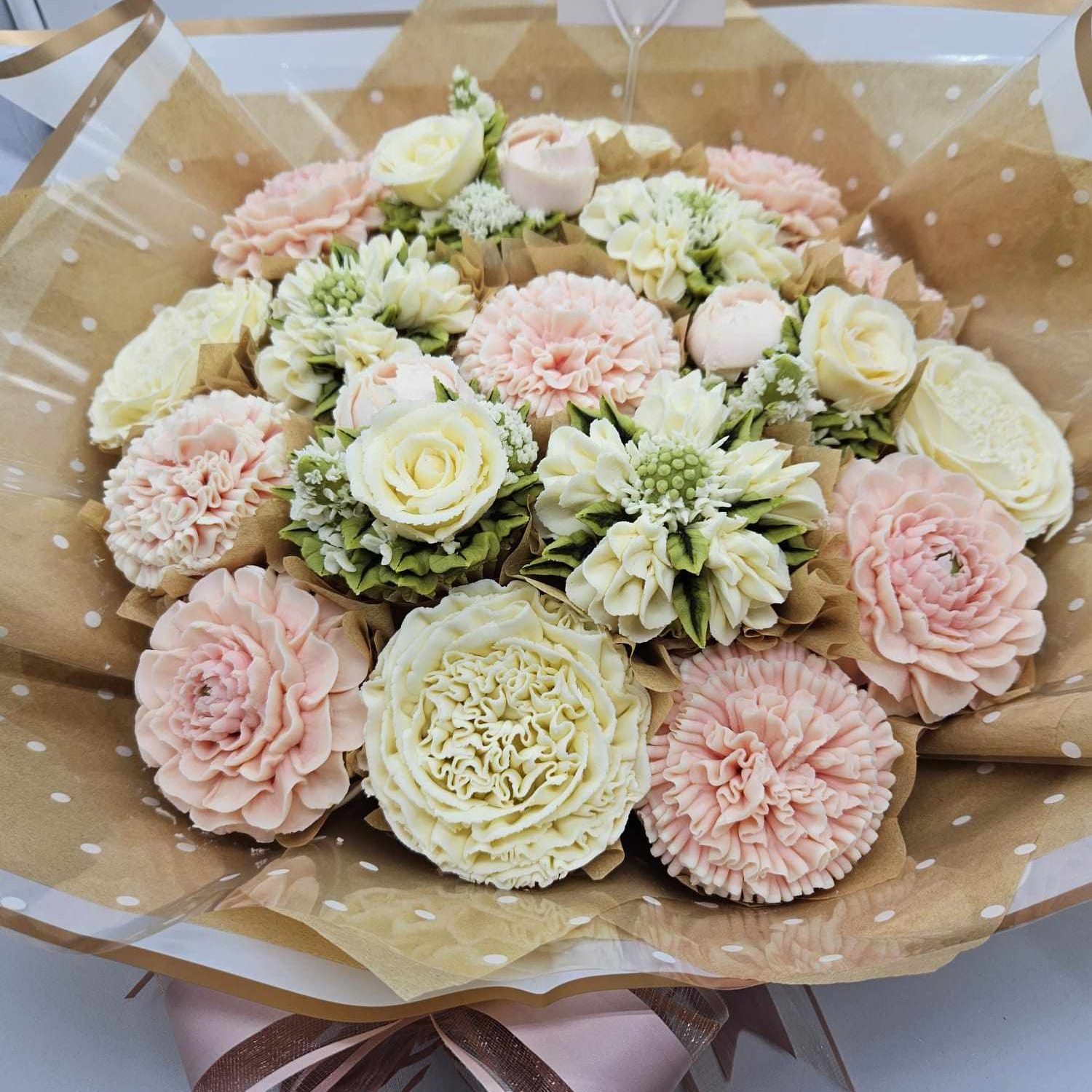 Luxury bouquet of hand piped flower cup cakes.