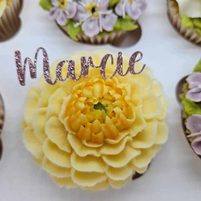 Beautifully presented, hand piped flower cupcake.