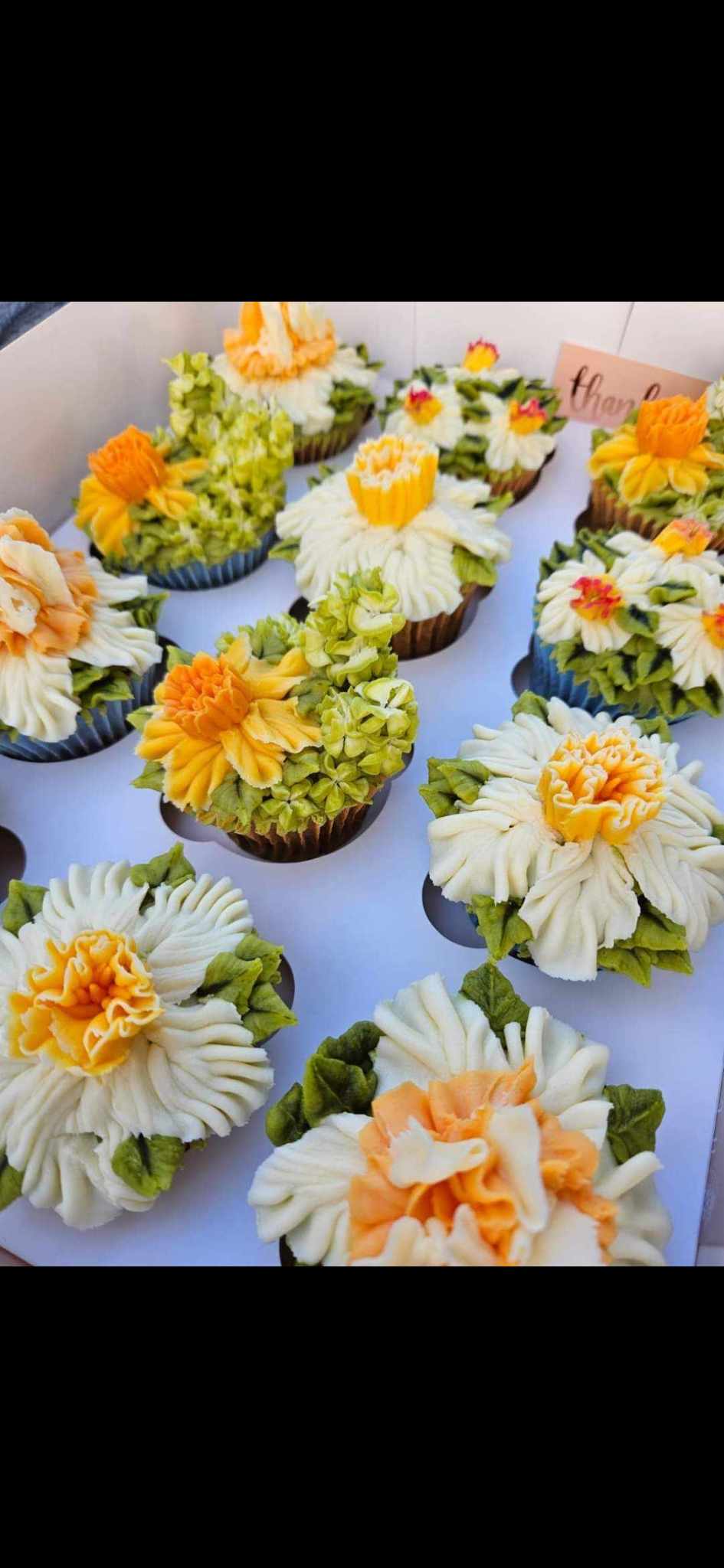 Cupcake boxes.  Here are some beautiful hand piped daffodils